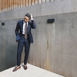 Grey Print Tie Outfits For Men: A navy suit and a grey print tie are a really sharp combo to try. Go ahead and throw in dark brown leather tassel loafers for a dose of stylish nonchalance.