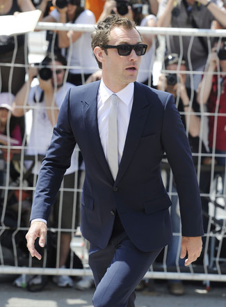 Jude Law wearing Navy Suit, White Dress Shirt, Grey Tie