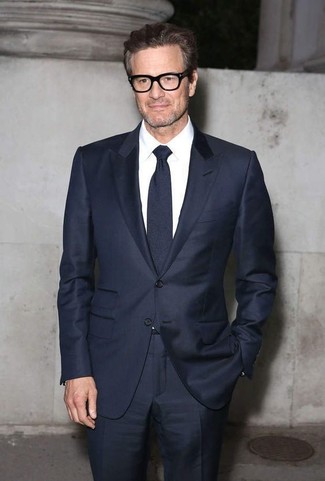 Colin Firth wearing Navy Suit, White Dress Shirt, Navy Tie
