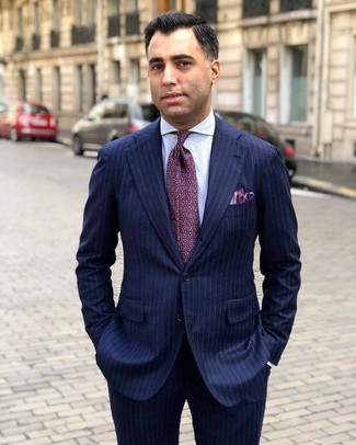 Dark Purple Tie Outfits For Men: Irrefutable proof that a navy vertical striped suit and a dark purple tie look awesome when matched together in a classy getup for today's gent.