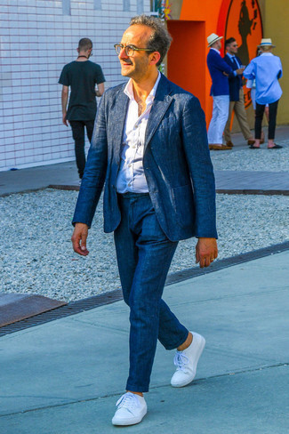 Clear Sunglasses Dressy Outfits For Men After 40: A navy linen suit and clear sunglasses paired together are a great match. White canvas low top sneakers tie the look together. This outfit proves that in your 40s you still have a wide range of style options.