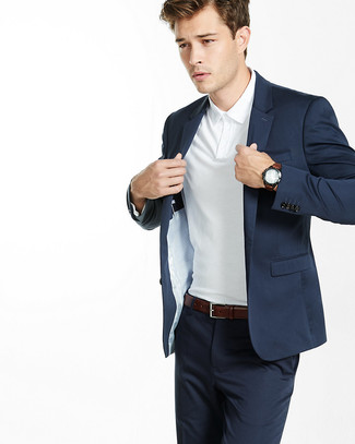 White Polo Outfits For Men: Go for polished style in a white polo and a navy suit.