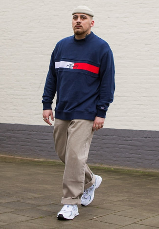 Navy and White Print Sweatshirt Outfits For Men: For a cool and casual getup, dress in a navy and white print sweatshirt and khaki chinos — these items fit really nice together. Add a pair of white and black athletic shoes to the mix to effortlessly step up the cool of this outfit.