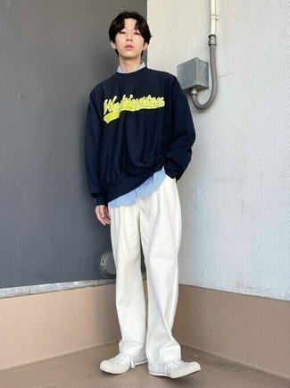 Navy and White Print Sweatshirt Outfits For Men: This ensemble with a navy and white print sweatshirt and white jeans isn't super hard to assemble and is easy to adapt throughout the day. White canvas low top sneakers are a smart option to finish off your ensemble.