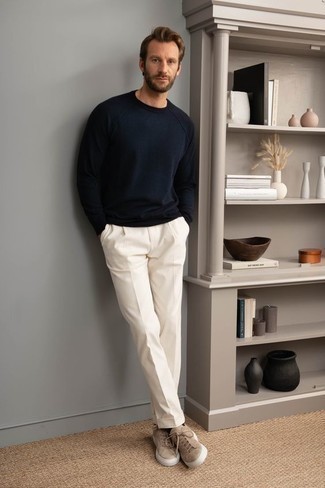 Low Top Sneakers Outfits For Men: If you're hunting for an off-duty but also sharp outfit, wear a navy sweatshirt and white chinos. Complement this look with a pair of low top sneakers and ta-da: this ensemble is complete.