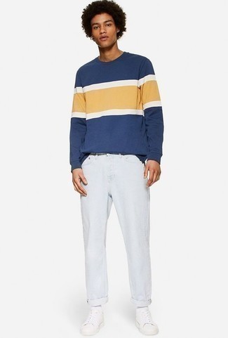 Navy and White Print Sweatshirt Outfits For Men: If you're on the lookout for a casual but also seriously stylish look, go for a navy and white print sweatshirt and white jeans. If you're puzzled as to how to round off, a pair of white leather low top sneakers is a surefire option.