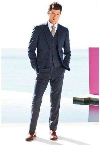 Navy Plaid Suit Outfits: You're looking at the hard proof that a navy plaid suit and a white dress shirt look amazing when worn together in a polished outfit for a modern guy. Burgundy leather tassel loafers are a great choice to finish off your ensemble.