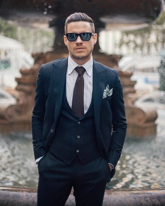 Navy Three Piece Suit Outfits: Go for an elegant getup in a navy three piece suit and a white vertical striped dress shirt.
