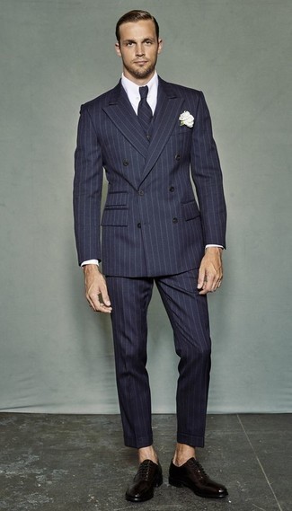 Navy Vertical Striped Three Piece Suit Outfits: Teaming a navy vertical striped three piece suit with a white dress shirt is an on-point choice for a dapper and elegant outfit. A pair of dark purple leather oxford shoes can integrate nicely within many looks.