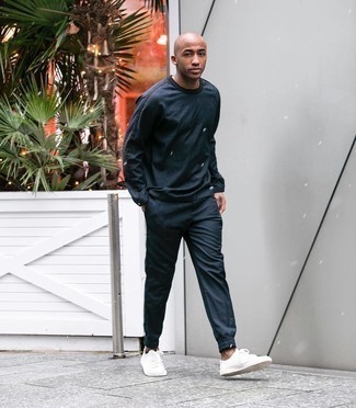 Navy Track Suit Outfits For Men: Opt for a navy track suit, if you want to dress for comfort but would also like to look stylish. Why not introduce a pair of white canvas low top sneakers to the equation for a hint of class?