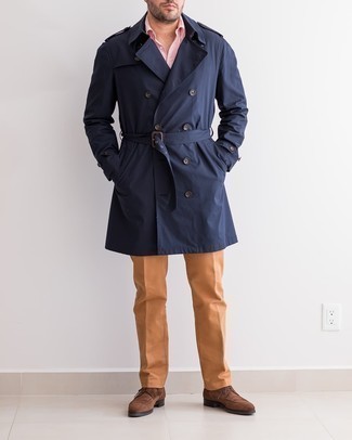 Navy Trenchcoat Outfits For Men: This pairing of a navy trenchcoat and tobacco chinos is great for semi-casual occasions. Not sure how to complete this look? Round off with brown suede derby shoes to dress it up.