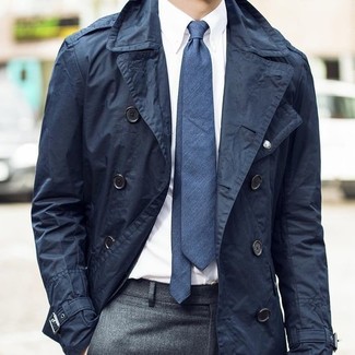 Navy Trenchcoat Outfits For Men: Irrefutable proof that a navy trenchcoat and grey dress pants are amazing when worn together in a polished look for a modern guy.
