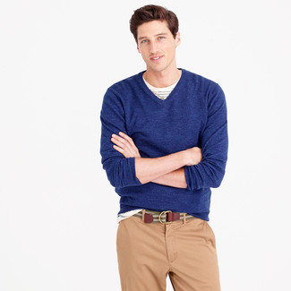 Tan Canvas Belt Outfits For Men: This combination of a navy v-neck sweater and a tan canvas belt is irrefutable proof that a simple off-duty outfit can still look really interesting.