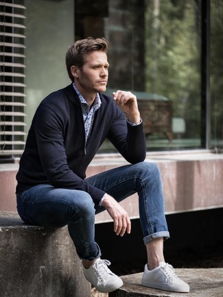 White and Blue Floral Dress Shirt Outfits For Men: A white and blue floral dress shirt and navy jeans are indispensable players in any modern man's sartorial collection. Does this outfit feel all-too-fancy? Let a pair of white leather low top sneakers spice things up.
