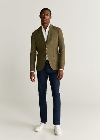 Olive Blazer Outfits For Men: An olive blazer and navy jeans married together are a perfect match. For a more laid-back spin, add a pair of white canvas low top sneakers to the equation.