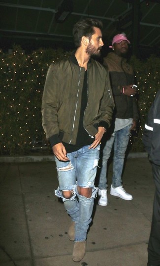  Scott Disick wearing Olive Bomber Jacket, Black Crew-neck T-shirt, Light Blue Ripped Jeans, Grey Suede Chelsea Boots