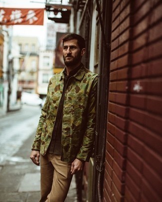 Dark Green Camouflage Shirt Jacket Outfits For Men: This combination of a dark green camouflage shirt jacket and khaki chinos is super easy to imitate and so comfortable to sport all day long as well!