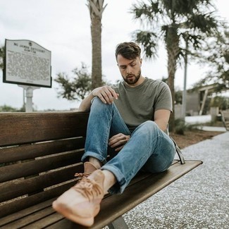 Tan Athletic Shoes Outfits For Men: Consider teaming an olive crew-neck t-shirt with blue jeans for an off-duty ensemble with a modern take. A pair of tan athletic shoes will add a playful feel to your ensemble.
