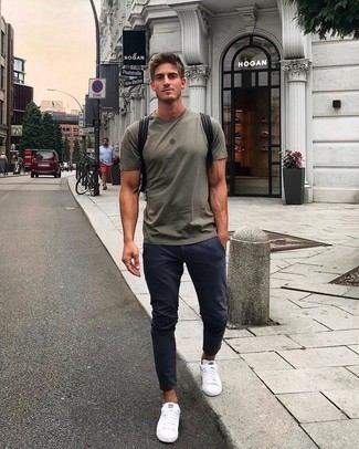 Dark Green Print Crew-neck T-shirt Outfits For Men: Such pieces as a dark green print crew-neck t-shirt and navy chinos are an easy way to infuse some cool into your casual routine. If you don't know how to finish, complement this look with white canvas low top sneakers.