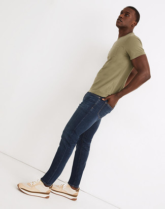 Navy Jeans Relaxed Outfits For Men: Demonstrate your chops in men's fashion by wearing this relaxed casual combination of an olive crew-neck t-shirt and navy jeans. Beige athletic shoes will add a dressed-down touch to your getup.