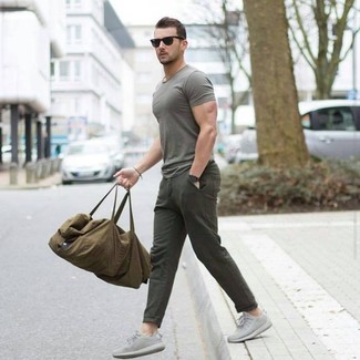 Dark Green Crew-neck T-shirt Outfits For Men: This casually cool outfit is super straightforward: a dark green crew-neck t-shirt and olive chinos. Complement your outfit with grey athletic shoes to instantly dial up the cool of your ensemble.