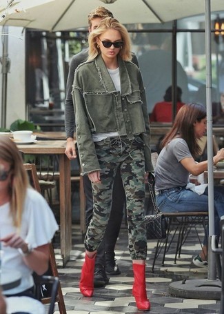 Olive Camouflage Skinny Jeans Outfits: If you're a fan of stay-in clothes which are stylish enough to wear out, go for an olive denim jacket and olive camouflage skinny jeans. And if you want to instantly up the style ante of this getup with footwear, why not add a pair of red leather ankle boots to the mix?