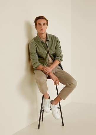 Tan Crew-neck T-shirt Outfits For Men: This ensemble with a tan crew-neck t-shirt and khaki chinos isn't so hard to pull off and leaves room to more experimentation. White leather low top sneakers are a winning footwear option that's full of character.