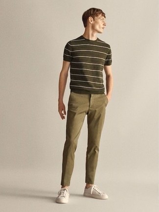 Olive Horizontal Striped Crew-neck T-shirt Outfits For Men: This pairing of an olive horizontal striped crew-neck t-shirt and olive chinos is on the casual side yet it's also seriously stylish and razor-sharp. Now all you need is a pair of white leather low top sneakers to complete this ensemble.