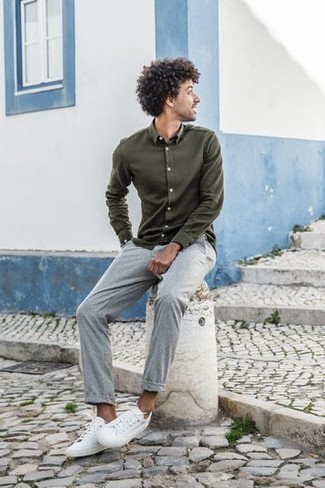 Dark Green Long Sleeve Shirt Outfits For Men: This look with a dark green long sleeve shirt and grey chinos isn't so hard to score and is easy to adapt. Feeling transgressive? Spice up your look by sporting a pair of white canvas low top sneakers.