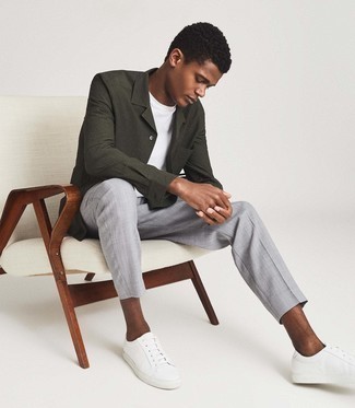 Seersucker Long Sleeve Shirt Outfits For Men: You'll be surprised at how easy it is for any gentleman to put together this laid-back outfit. Just a seersucker long sleeve shirt and grey chinos. Send an otherwise classic ensemble in a more informal direction by slipping into white leather low top sneakers.