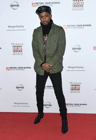 Lakeith Stanfield wearing Olive Military Jacket, Black Print Turtleneck, Black Skinny Jeans, Black Leather Chelsea Boots