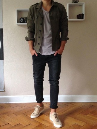 Tan Canvas Low Top Sneakers Outfits For Men: Combining an olive military jacket and black skinny jeans will prove your skills in men's fashion even on off-duty days. Add a pair of tan canvas low top sneakers to the equation and ta-da: the getup is complete.