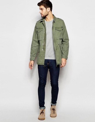 Navy Skinny Jeans Outfits For Men: This casual pairing of an olive military jacket and navy skinny jeans can go different ways according to how you style it. For something more on the classy side to complement this outfit, add beige suede desert boots to this ensemble.