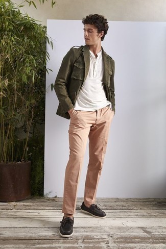 Military Jacket Outfits For Men: Combining a military jacket with khaki chinos is an amazing pick for a laid-back yet on-trend getup. If you're hesitant about how to finish, complement your outfit with a pair of black leather boat shoes.