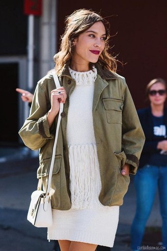 White Sweater Dress Casual Outfits: This relaxed casual combination of a white sweater dress and an olive military jacket is a safe bet when you need to look stylish in a flash.
