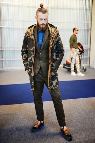 Dark Green Suit Outfits: This combination of a dark green suit and an olive camouflage parka epitomizes manly elegance and effortless style. If you don't want to go all out formal, introduce a pair of dark green suede low top sneakers to the mix.