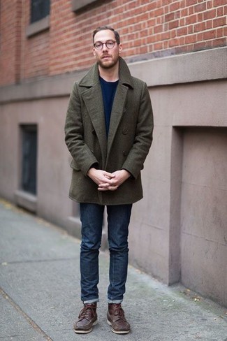 Navy Crew-neck Sweater Cold Weather Outfits For Men: You'll be amazed at how easy it is for any man to put together this casual look. Just a navy crew-neck sweater and navy jeans. Amp up your outfit by wearing a pair of brown leather work boots.
