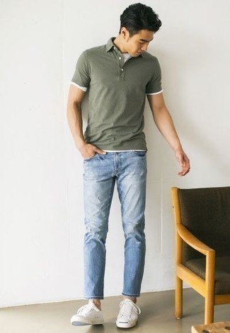 Dark Green Polo Outfits For Men: For a laid-back and cool outfit, try teaming a dark green polo with light blue ripped jeans — these two items go really good together. Serve a little outfit-mixing magic by slipping into a pair of white canvas low top sneakers.