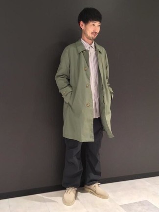 Olive Raincoat Outfits For Men: This casual and cool look is super straightforward: an olive raincoat and black chinos. Beige suede desert boots look awesome here.