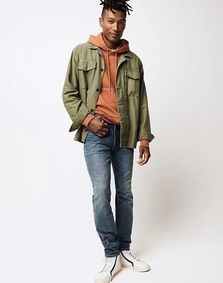 Blue Jeans Outfits For Men: Pair an olive shirt jacket with blue jeans to put together an interesting and current relaxed ensemble. A pair of white and black canvas high top sneakers immediately dials up the street cred of this outfit.