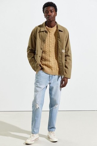 Beige Cable Sweater Outfits For Men: A beige cable sweater and light blue ripped jeans are wonderful menswear must-haves that will integrate wonderfully within your casual styling collection. Add a pair of white canvas high top sneakers to the mix and ta-da: this outfit is complete.
