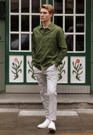 Olive Shirt Jacket Outfits For Men: An olive shirt jacket and grey chinos are among the foundations of any good menswear collection. Send this outfit down a more casual path by sporting a pair of white leather low top sneakers.