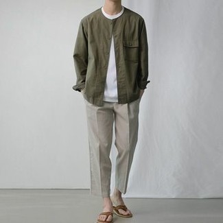 Tobacco Leather Flip Flops Outfits For Men: This combo of an olive shirt jacket and grey chinos is a never-failing option when you need to look dapper but have no time. A trendy pair of tobacco leather flip flops is the most effective way to inject a dash of stylish nonchalance into your look.