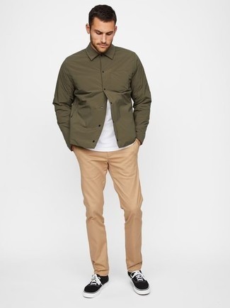 Olive Nylon Shirt Jacket Outfits For Men: Infuse personality into your current styling rotation with an olive nylon shirt jacket and khaki chinos. If you want to effortlessly play down this ensemble with shoes, introduce black and white canvas low top sneakers to the equation.