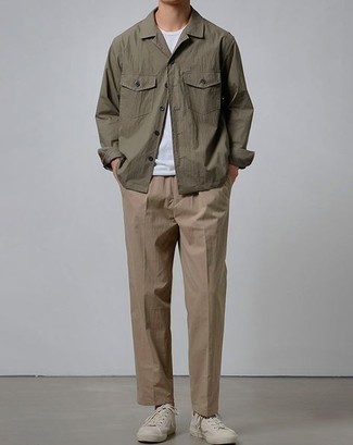 Olive Shirt Jacket with White Canvas Low Top Sneakers Casual Spring Outfits For Men: You'll be surprised at how easy it is for any guy to throw together this casually elegant look. Just an olive shirt jacket worn with khaki chinos. Feeling inventive? Tone down this ensemble by rounding off with white canvas low top sneakers. So if you're on a mission for a comfortable transition outfit, this is it.