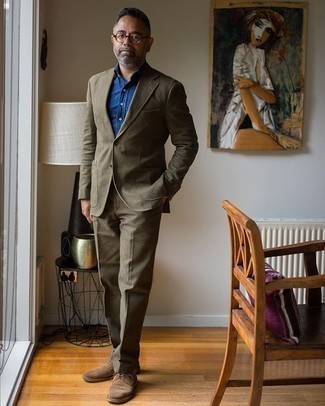 Brown Suede Derby Shoes Outfits: This pairing of an olive suit and a blue chambray dress shirt couldn't possibly come across other than seriously dapper and elegant. If you want to instantly dress down your look with one single piece, introduce a pair of brown suede derby shoes to the equation.
