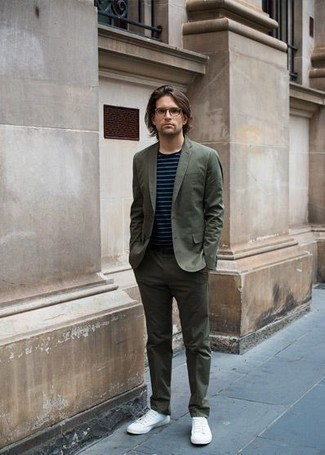 Men's Outfits 2022: Pairing an olive suit and a navy and white horizontal striped crew-neck t-shirt is a guaranteed way to inject personality into your closet. Go ahead and complement this look with white canvas low top sneakers for a more relaxed twist.