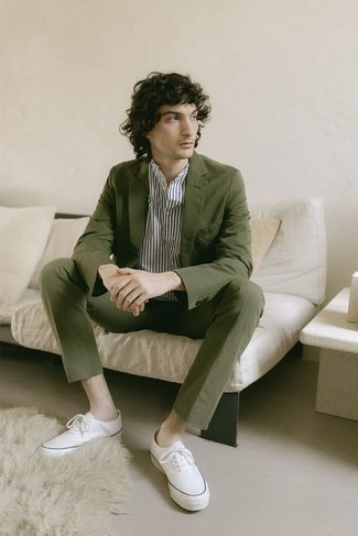 White and Black Shirt Smart Casual Outfits For Men: Go for a white and black shirt and an olive suit for a clean-cut refined outfit. If you're hesitant about how to round off, introduce white canvas low top sneakers to the mix.
