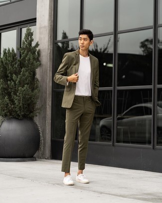 Olive Suit Outfits: Inject style into your current collection with an olive suit and a white crew-neck t-shirt. A pair of white canvas low top sneakers instantly steps up the street cred of this getup.