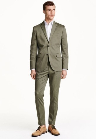 Olive Suit Outfits: This polished combination of an olive suit and a white dress shirt will be a good manifestation of your sartorial skills. Amp up the wow factor of this outfit by slipping into a pair of tan suede derby shoes.